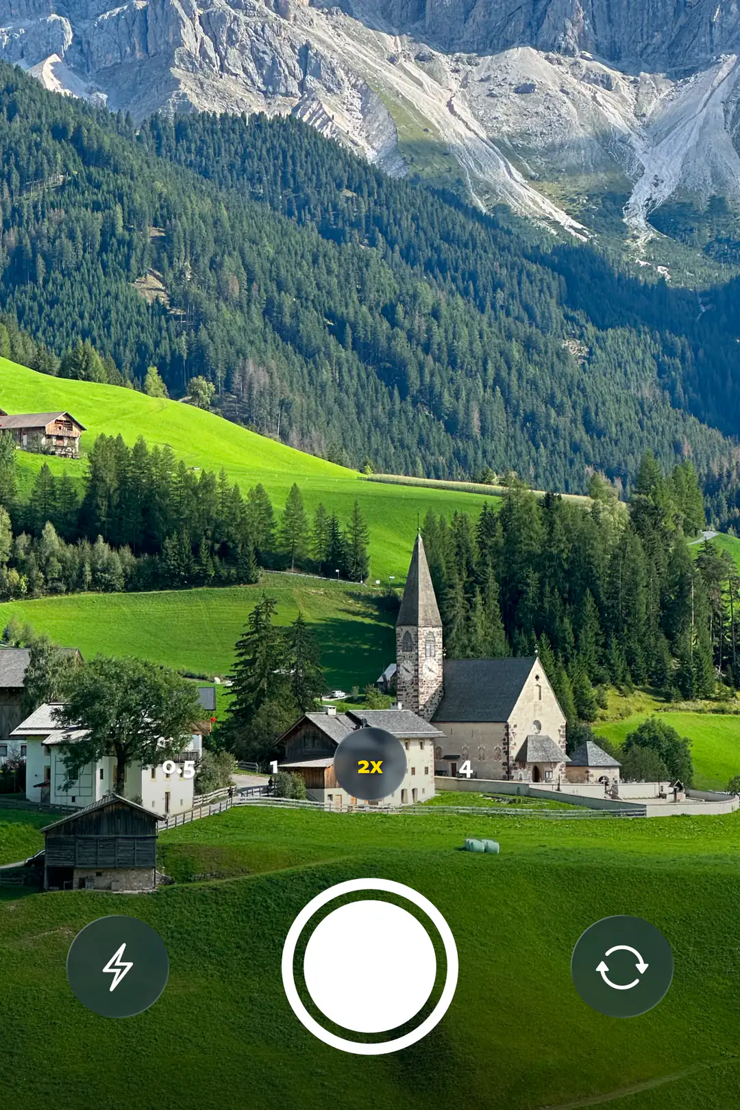The in-app camera framing a mountain valley, ready to capture a spot.